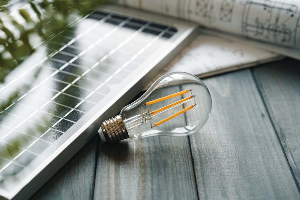 solar-energy-panel-and-light-bulb-green-energy-BT9XZ3G.jpg
